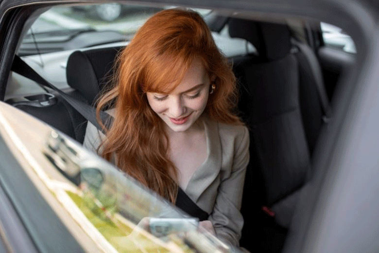 woman taking taxi to work