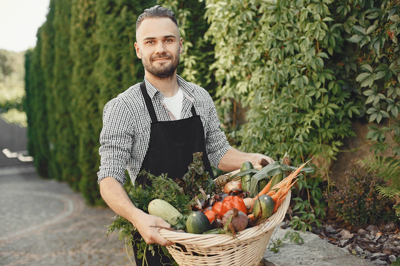 man holding fruits and vegetables