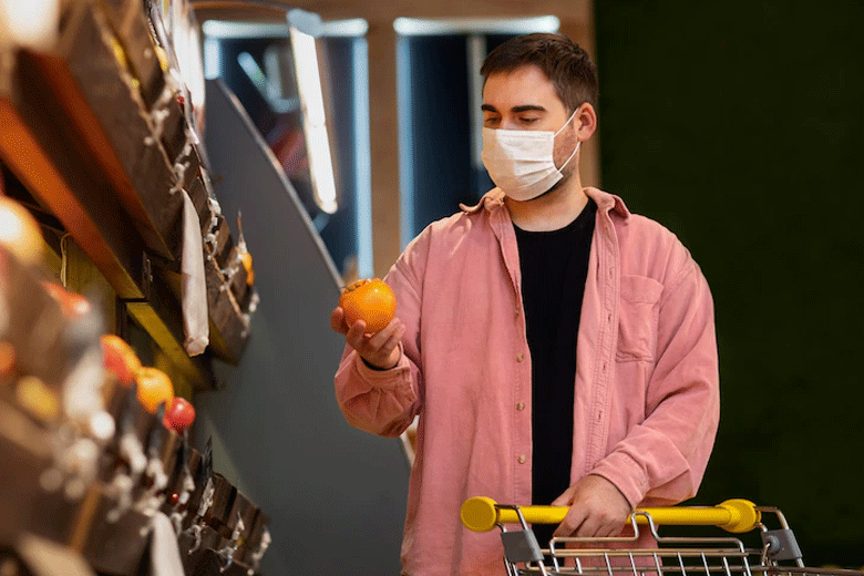man with oranges