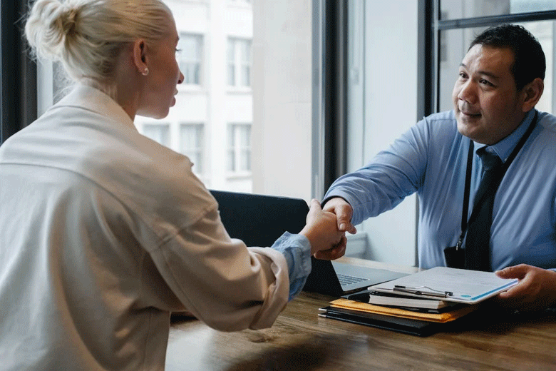 A man congratulates a lady