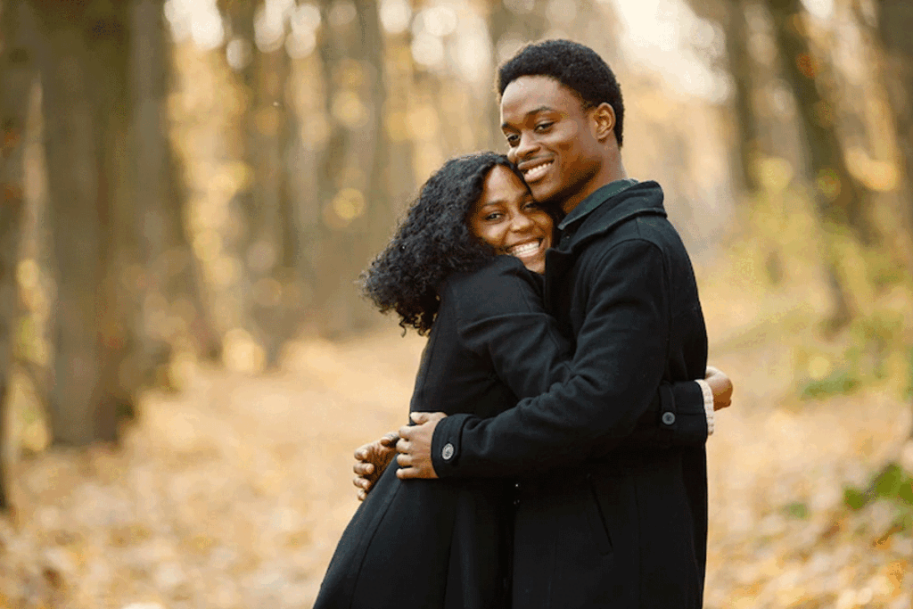 A man and his woman hugging happily