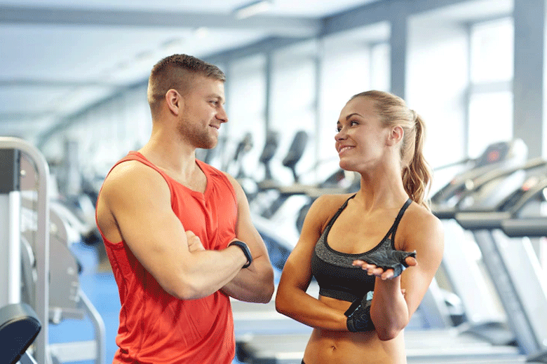 A guy checking out a lady at the gym